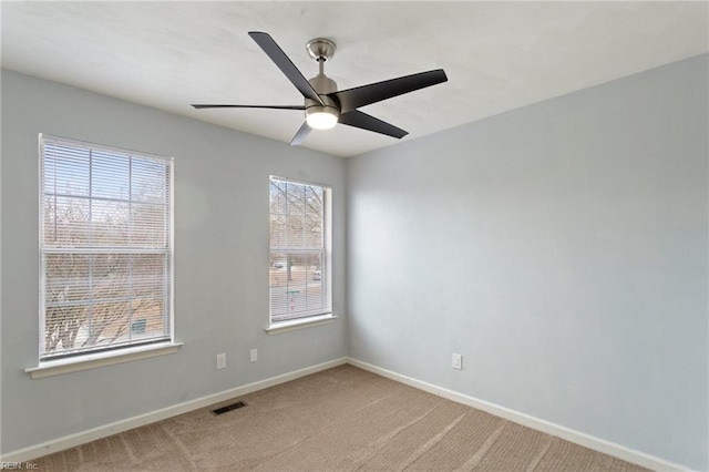 carpeted empty room with ceiling fan