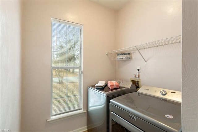 clothes washing area featuring washing machine and dryer