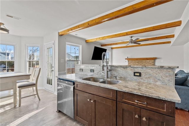 kitchen with dark brown cabinetry, beamed ceiling, sink, backsplash, and stainless steel dishwasher