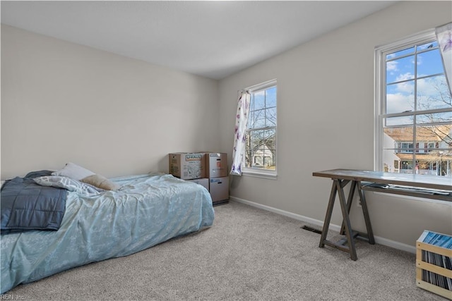 bedroom with light colored carpet