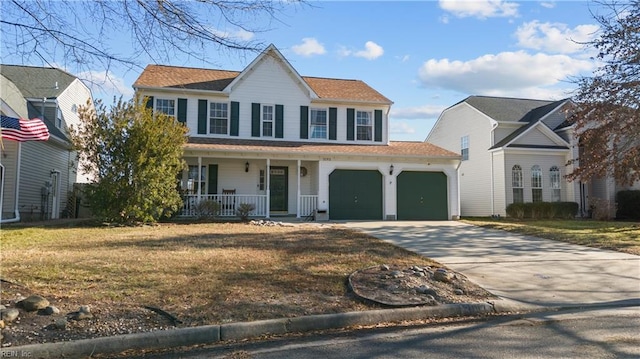 colonial home featuring covered porch, a front lawn, and a garage