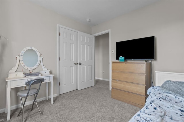 bedroom featuring light carpet