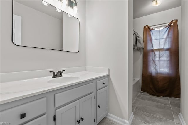 bathroom with tile patterned flooring, vanity, and bathtub / shower combination