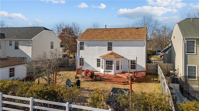 rear view of house with a wooden deck