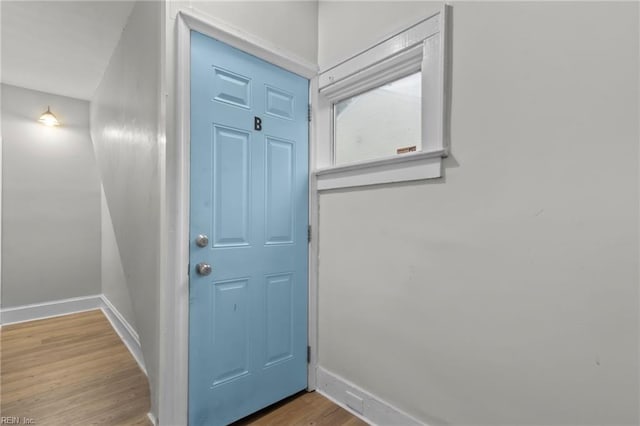 entryway with hardwood / wood-style flooring