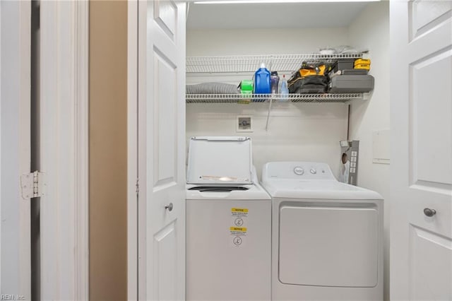 laundry area with washing machine and dryer