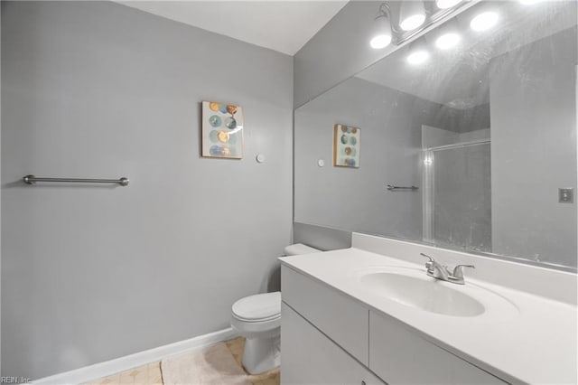 bathroom featuring toilet, tile patterned flooring, an enclosed shower, and vanity