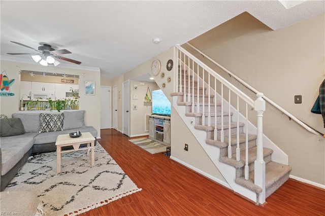 living room with ceiling fan and wood-type flooring