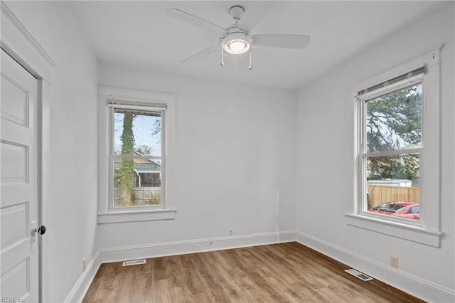 spare room featuring light hardwood / wood-style floors and ceiling fan