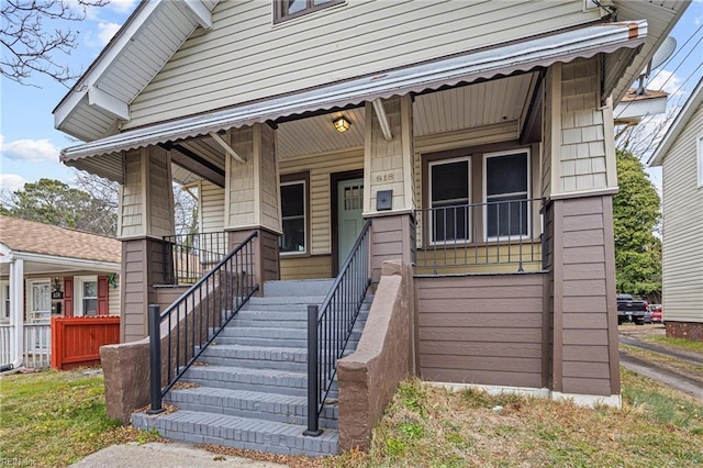 property entrance with covered porch