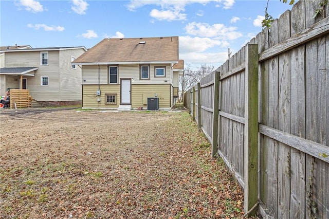 rear view of property with central air condition unit