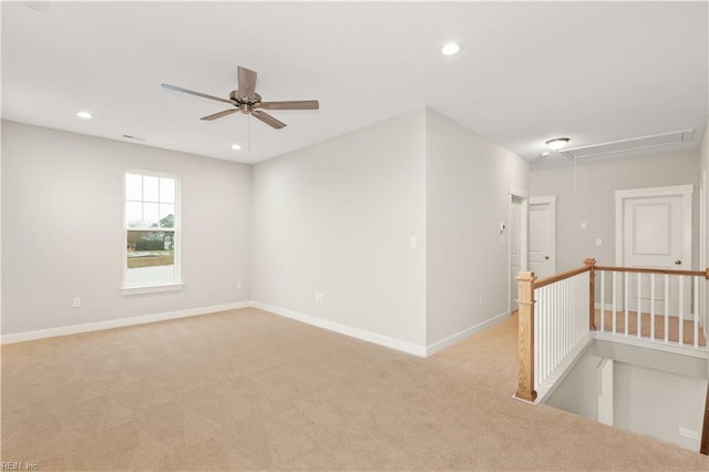 unfurnished room with ceiling fan and light colored carpet