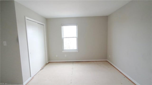 unfurnished bedroom with a closet