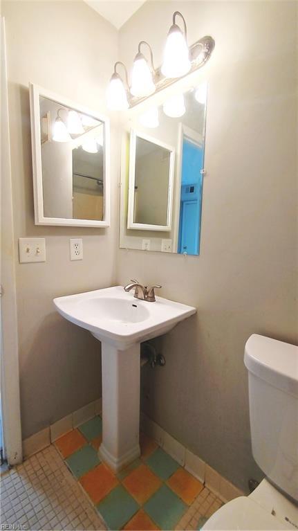 bathroom featuring tile patterned floors and toilet