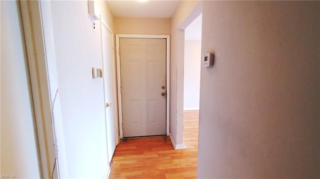 hall with light hardwood / wood-style floors