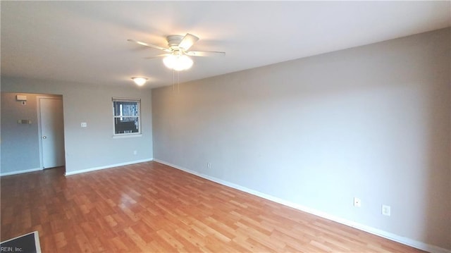 spare room featuring ceiling fan and hardwood / wood-style floors