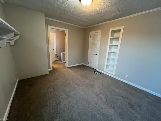 unfurnished bedroom featuring carpet, crown molding, and a textured ceiling