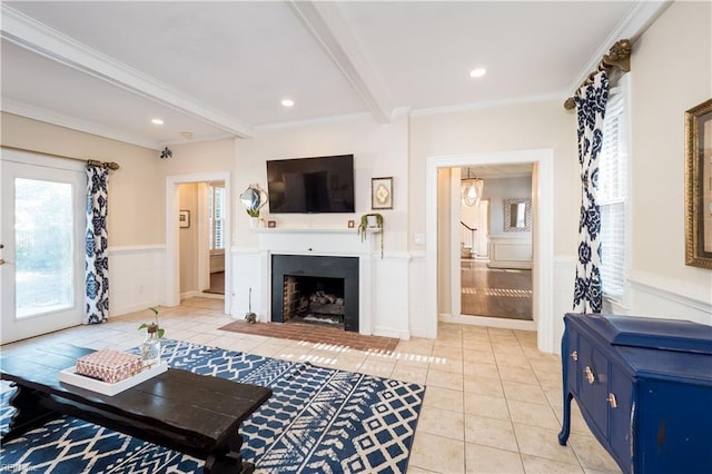 living room with light tile patterned flooring, ornamental molding, and beam ceiling