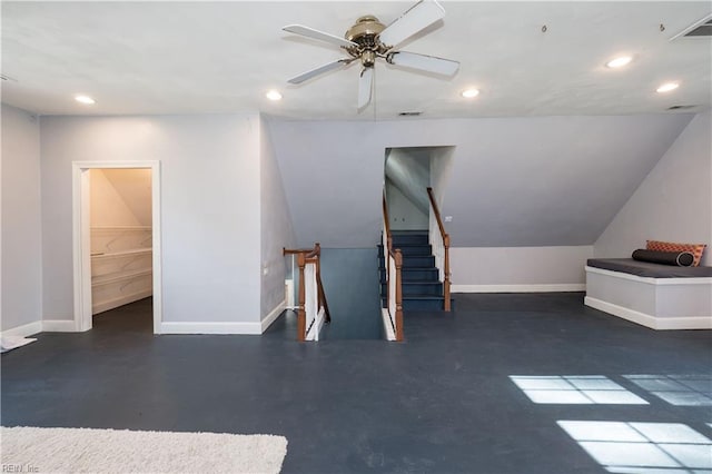 interior space featuring ceiling fan and vaulted ceiling