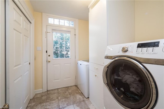 washroom featuring independent washer and dryer