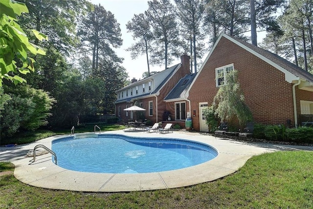 view of pool featuring a patio area