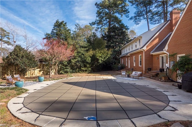 view of swimming pool featuring a patio