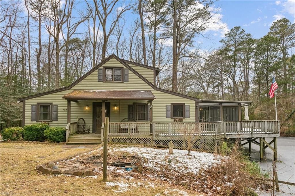 view of front of house featuring a deck and a sunroom