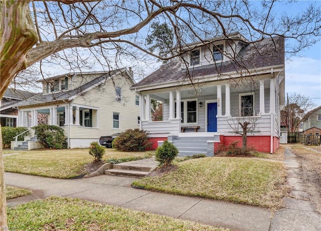 bungalow-style home with a front yard and a porch