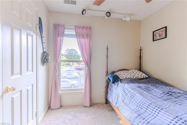 carpeted bedroom featuring ceiling fan