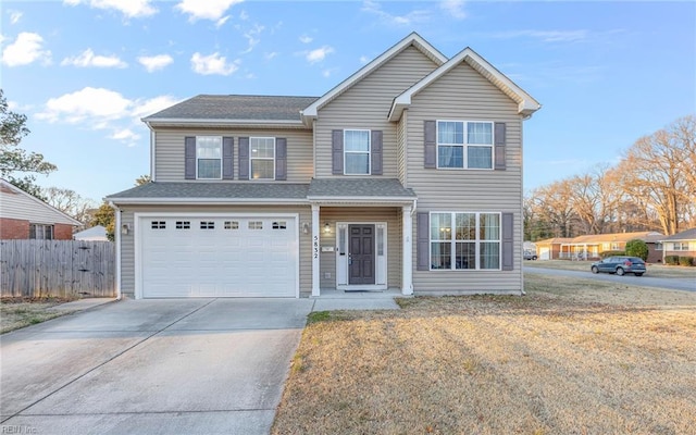 view of front property with a front lawn and a garage