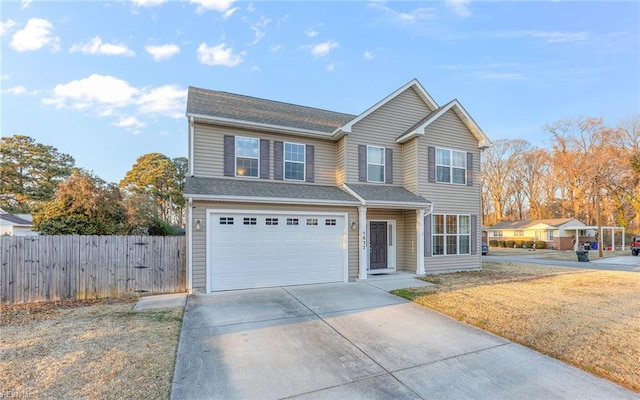 view of front property with a front lawn and a garage