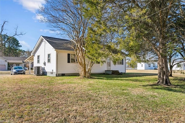 view of property exterior featuring cooling unit and a yard