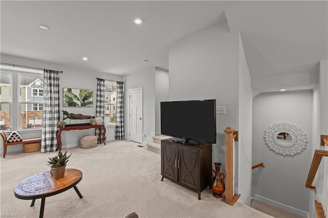 living room with plenty of natural light and light colored carpet