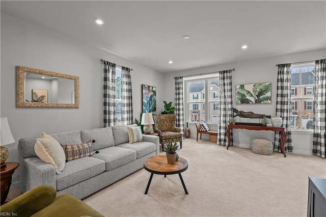 living room with light colored carpet and a healthy amount of sunlight