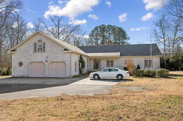 ranch-style home featuring a garage