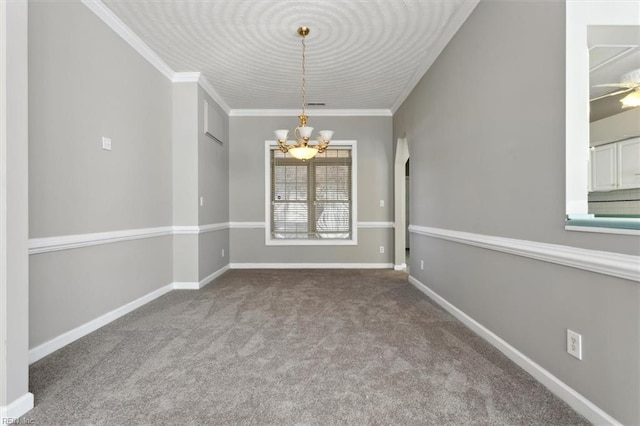 carpeted spare room featuring ceiling fan with notable chandelier and ornamental molding