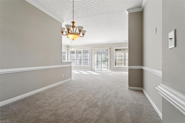 unfurnished living room with carpet floors, crown molding, and a chandelier