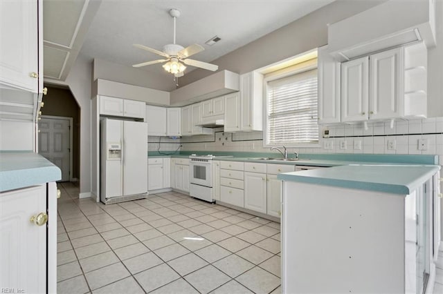 kitchen featuring white appliances, white cabinetry, sink, ceiling fan, and light tile patterned floors