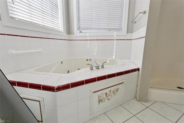 bathroom with a shower and tile patterned floors