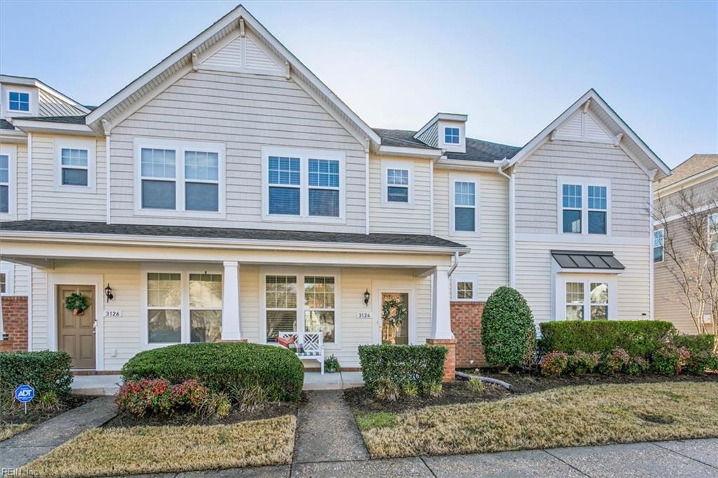 townhome / multi-family property featuring a porch