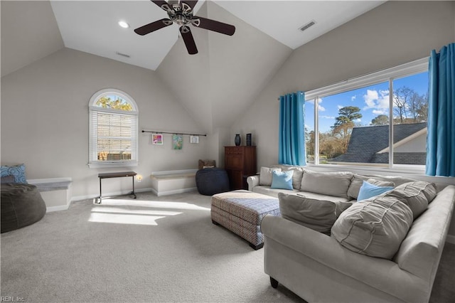 carpeted living room featuring ceiling fan and vaulted ceiling