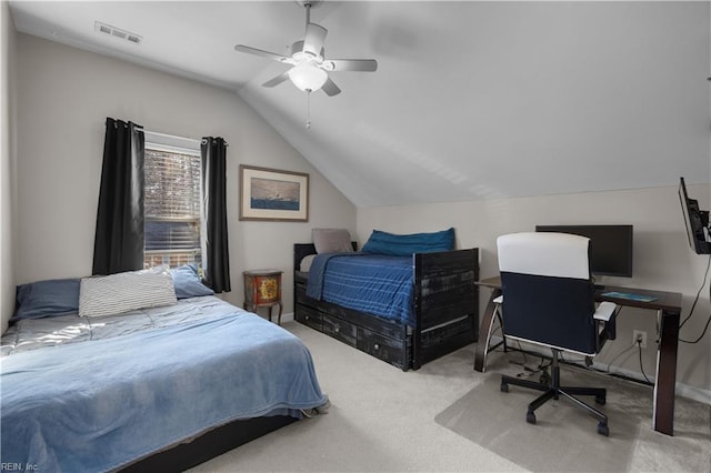 bedroom with ceiling fan, vaulted ceiling, and carpet