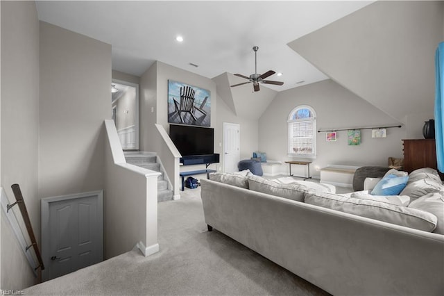 carpeted living room featuring lofted ceiling and ceiling fan