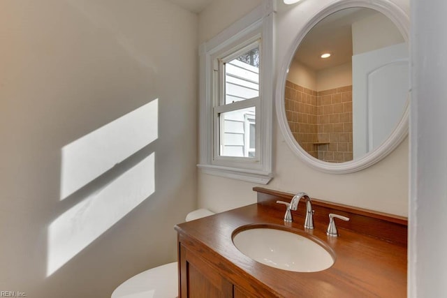 bathroom featuring toilet and vanity