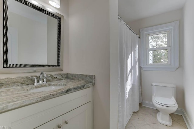 bathroom with toilet, tile patterned flooring, walk in shower, and vanity