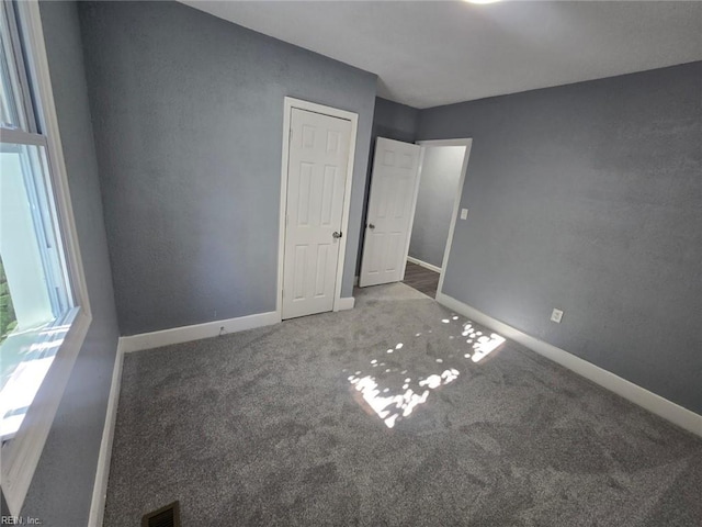 unfurnished bedroom featuring carpet