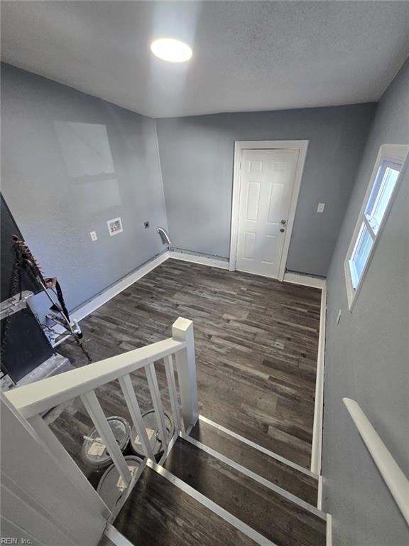 staircase featuring hardwood / wood-style flooring