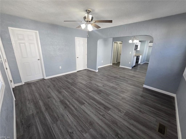 spare room featuring ceiling fan, a textured ceiling, and dark hardwood / wood-style floors