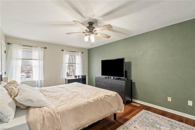 bedroom featuring ceiling fan and dark hardwood / wood-style flooring