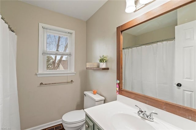 bathroom with toilet and vanity